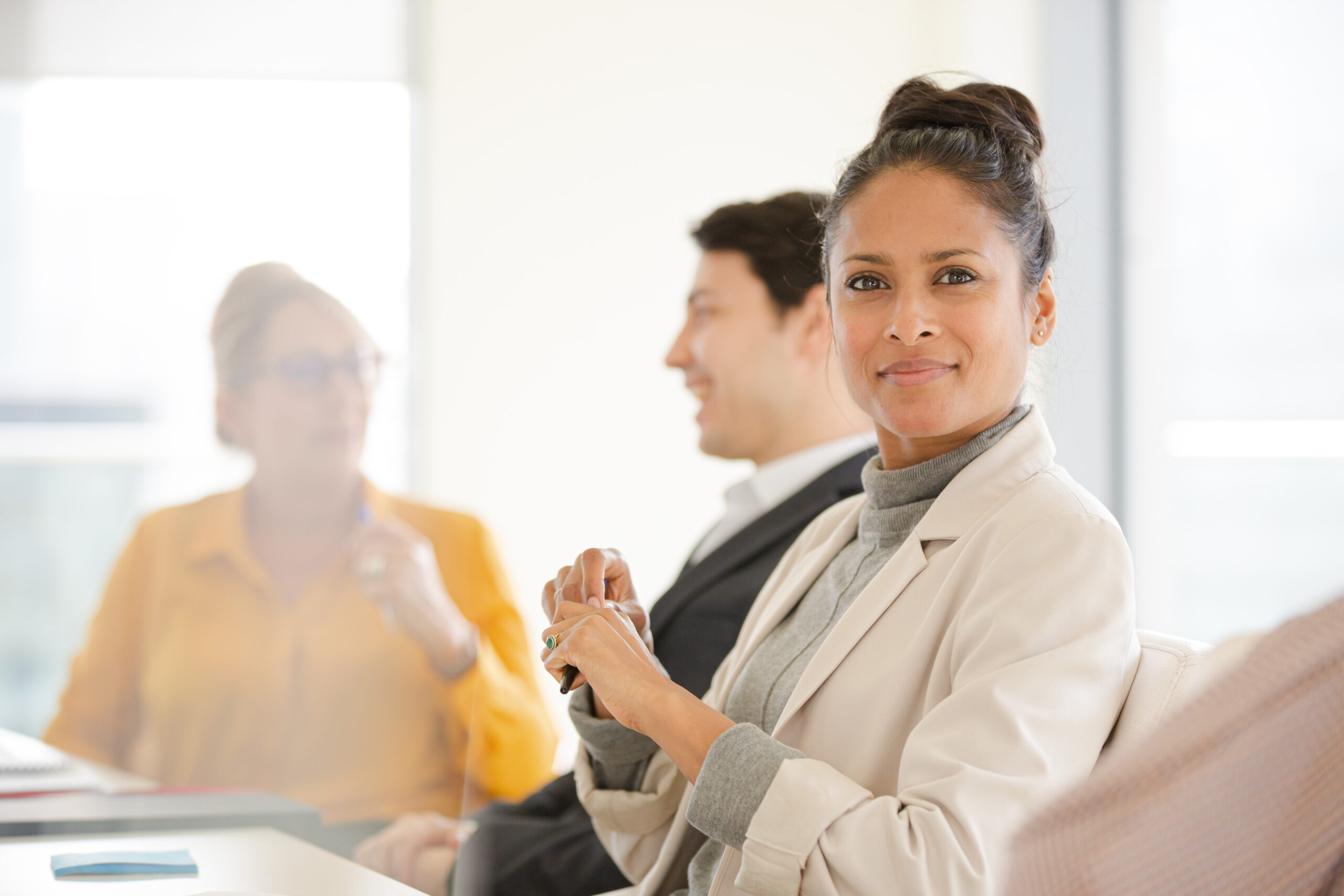 Portrait of smiling businesswoman in conference room meeting